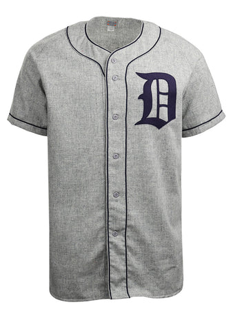 The EFF Duke University 1953 Road Jersey is a gray short-sleeve button-down with black piping and a bold black letter D on the left chest, inspired by the classic College Vault flannel design.
