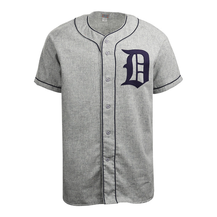 The EFF Duke University 1953 Road Jersey is a gray short-sleeve button-down with black piping and a bold black letter D on the left chest, inspired by the classic College Vault flannel design.