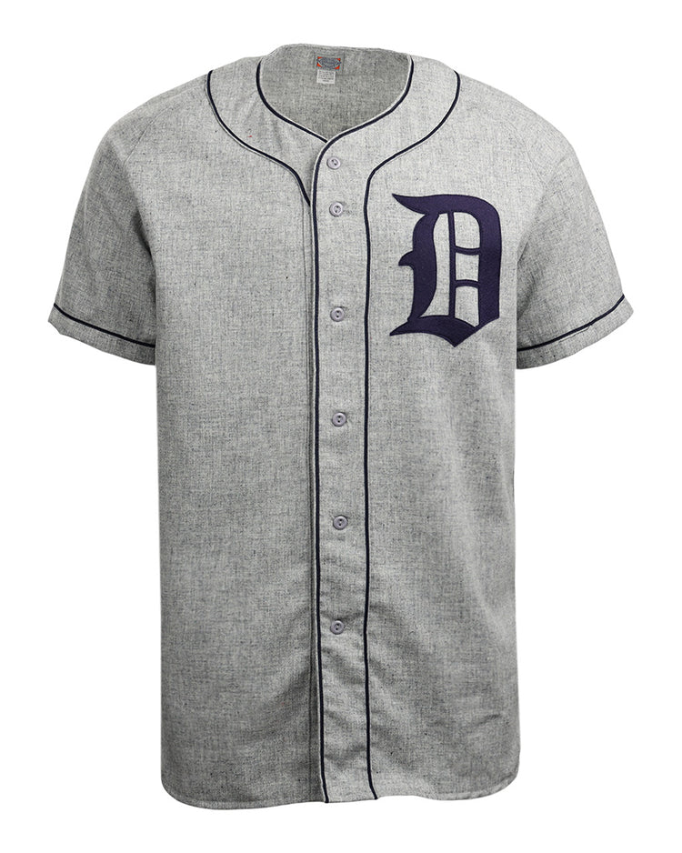 The EFF Duke University 1953 Road Jersey is a gray short-sleeve button-down with black piping and a bold black letter D on the left chest, inspired by the classic College Vault flannel design.