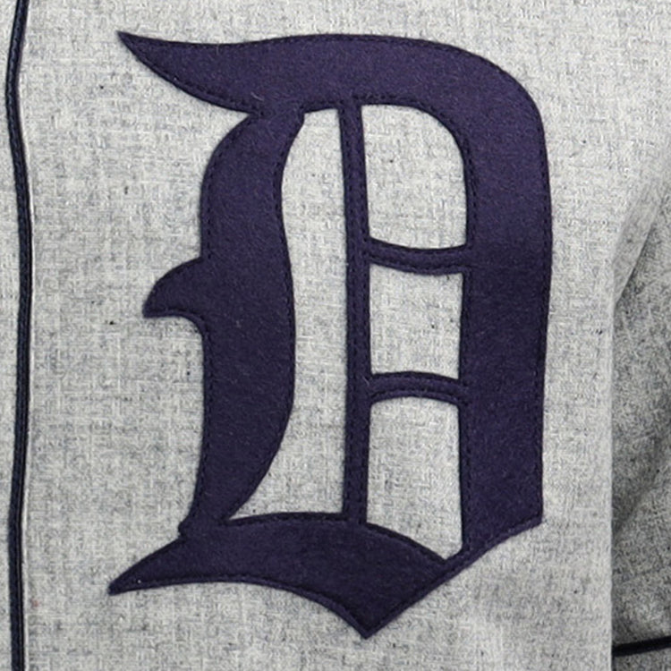 A large, dark blue Old English D is stitched onto light gray fabric on the EFF Duke University 1953 Road Jersey, inspired by a classic College Vault design.
