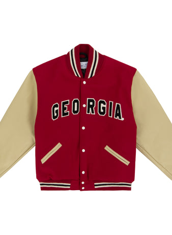 The EFF University of Georgia 1966 Authentic Jacket features a red body, beige sleeves, and striped details. GEORGIA is boldly displayed in black and white across the chest, echoing the iconic 1966 varsity style.