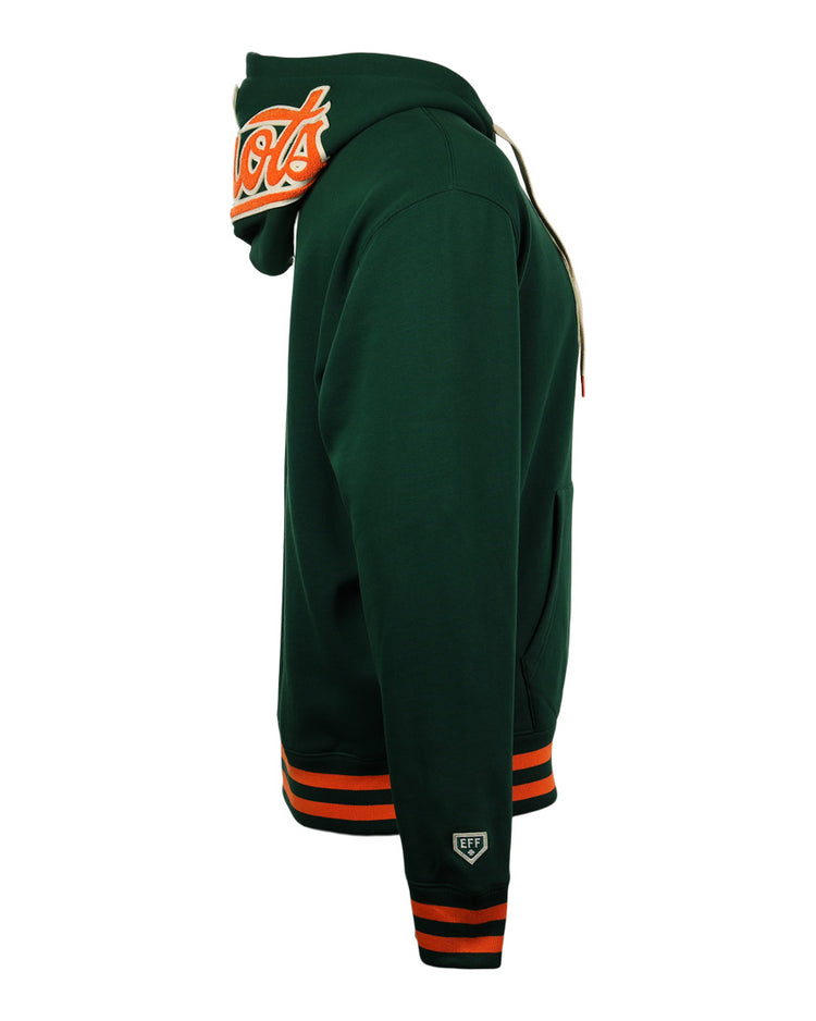 Side view of the EFF Carrots Arlington Heights Collection Hoodie in dark green, featuring orange and white striped cuffs and waistband, sleeve patch, and large embroidered Arlington Heights Carrots logo on the raised hood.