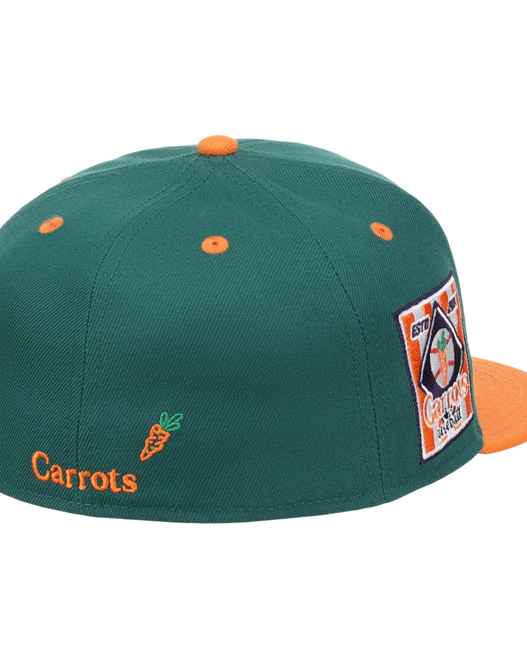 The EFF Carrots Arlington Heights Collection Logo Fitted Ballcap is green with orange accents, an orange button and brim, star side patch, and Carrots text plus carrot graphic on the back. Part of the Carrots Ebbets Field Flannels collection.