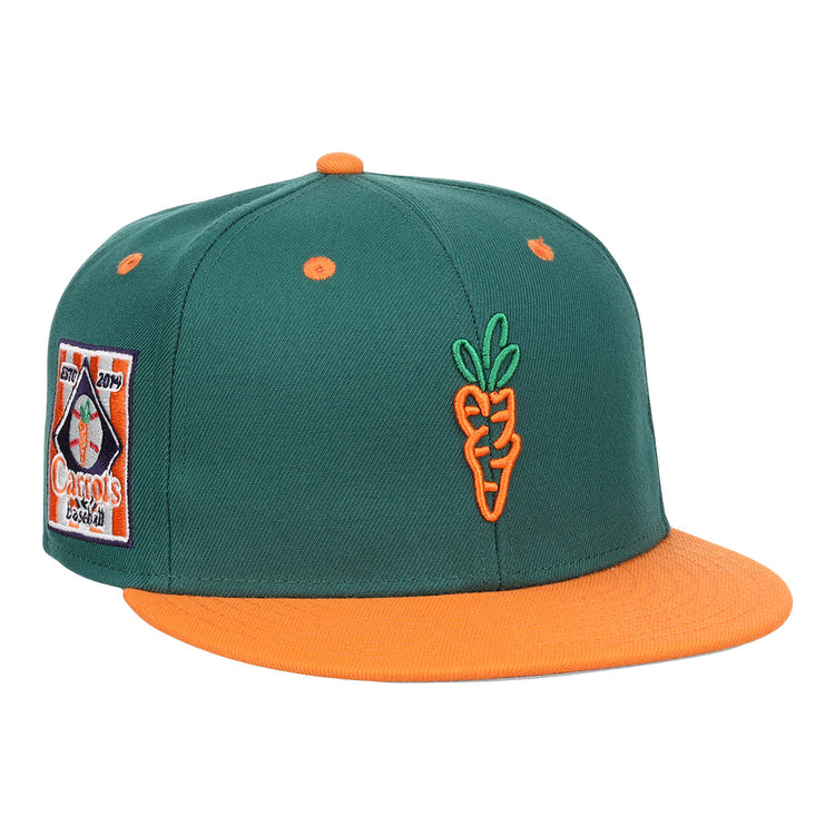 The EFF Carrots Arlington Heights Collection Logo Fitted Ballcap features green fabric, an orange brim and button, an embroidered orange carrot on the front, and a colorful side patch in the classic Ebbets Field Flannels style.