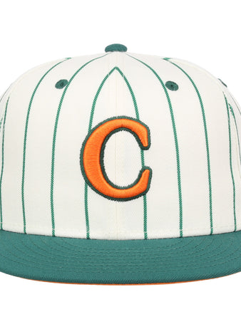 The EFF Carrots Arlington Heights Collection Pinstripe Fitted Ballcap features white fabric with green pinstripes, a green brim, and an orange C outlined in green, made in collaboration with Ebbets Field Flannels.
