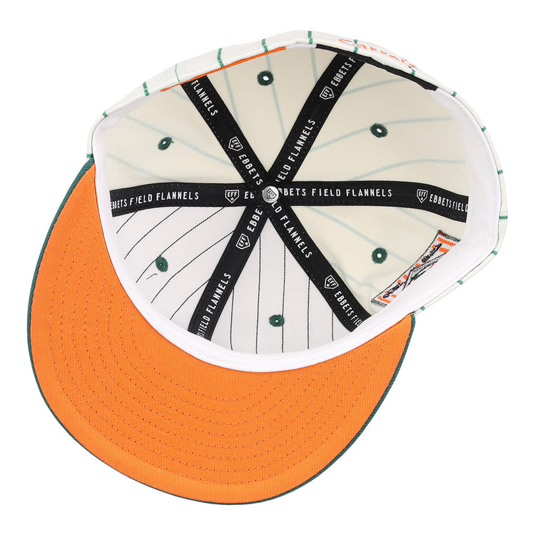 Interior view of the Carrots Arlington Heights Collection Pinstripe Fitted Ballcap by EFF, featuring orange brim stitching, green stripes and vents, plus black bands with the “EBBETS FIELD FLANNELS” logo from a brand collaboration.