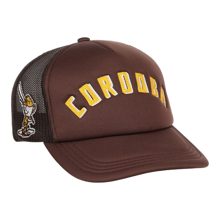 The Cordoba Cafeteros EFF DNA Trucker by EFF is a vintage-inspired brown trucker hat with yellow CORDOBA lettering on the front and an embroidered knight holding a sword on the black mesh side, in classic Ebbets Field Flannels style.