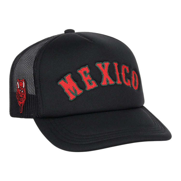 The EFF Mexico Diablos EFF DNA Trucker is a vintage-inspired hat with MEXICO embroidered in red and green on the front and a small red devil face on the side, channeling classic Mexican League and Ebbets Field Flannels vibes.