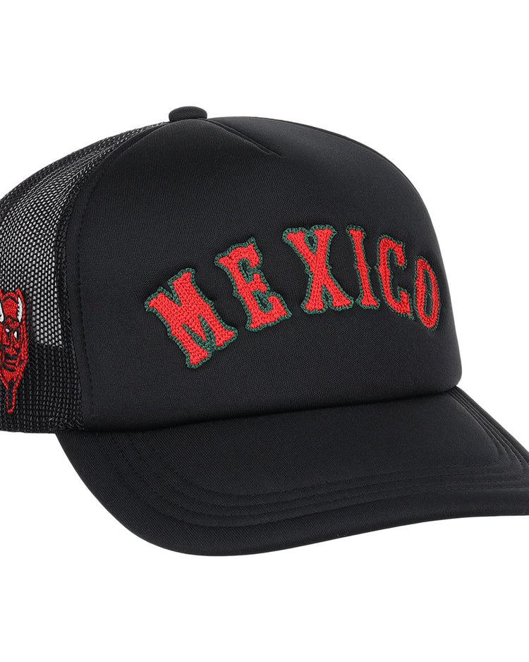 The EFF Mexico Diablos EFF DNA Trucker is a vintage-inspired hat with MEXICO embroidered in red and green on the front and a small red devil face on the side, channeling classic Mexican League and Ebbets Field Flannels vibes.