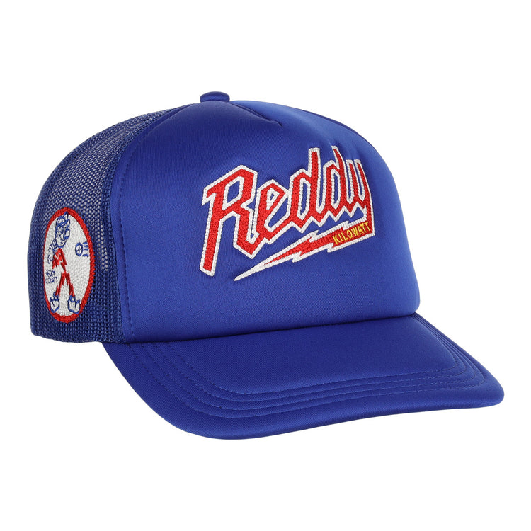 The EFF Reddy Kilowatt EFF DNA Trucker is a blue mesh hat featuring vintage-style chain-stitched red, white, and yellow Reddy Kilowatt embroidery on the front, plus a cartoon Reddy Kilowatt patch on the side.
