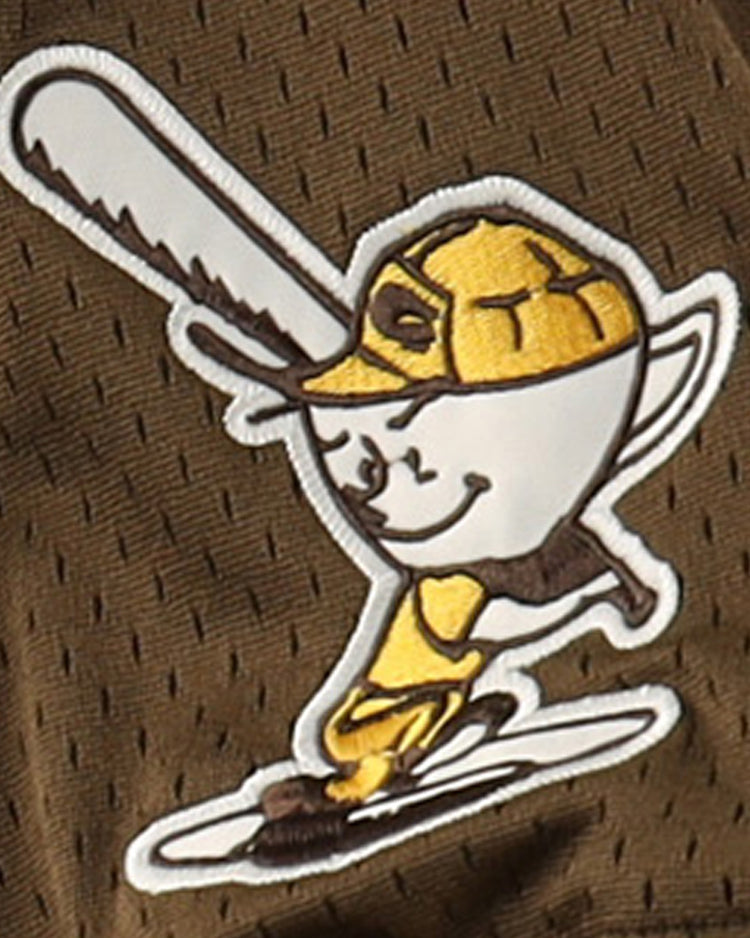 A cartoon egg in a yellow Cordoba Cafeteros cap and EFF uniform swings a big bat, smiling, on the Cordoba Cafeteros EFF DNA Replica V-Neck Mesh Jersey—a fun tribute to Mexican baseball history, with stick limbs adding playful charm.