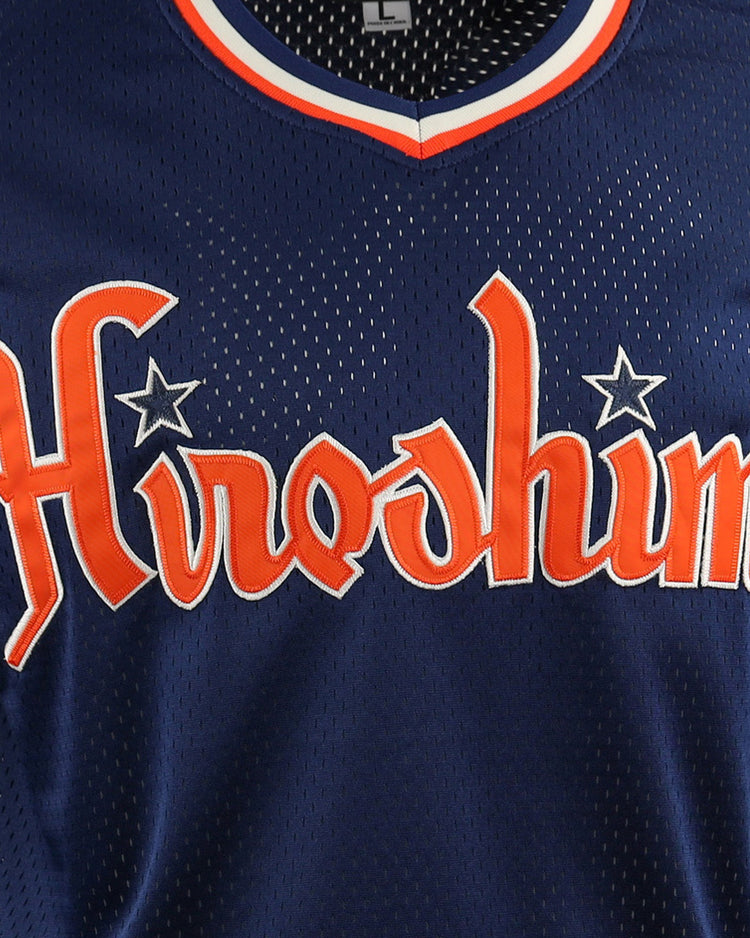 The EFF Hiroshima Carp EFF DNA Replica V-Neck Mesh Jersey is a navy blue vintage mesh jersey with Hiroshima in bold orange and white across the chest—ideal for passionate Hiroshima Carp fans.