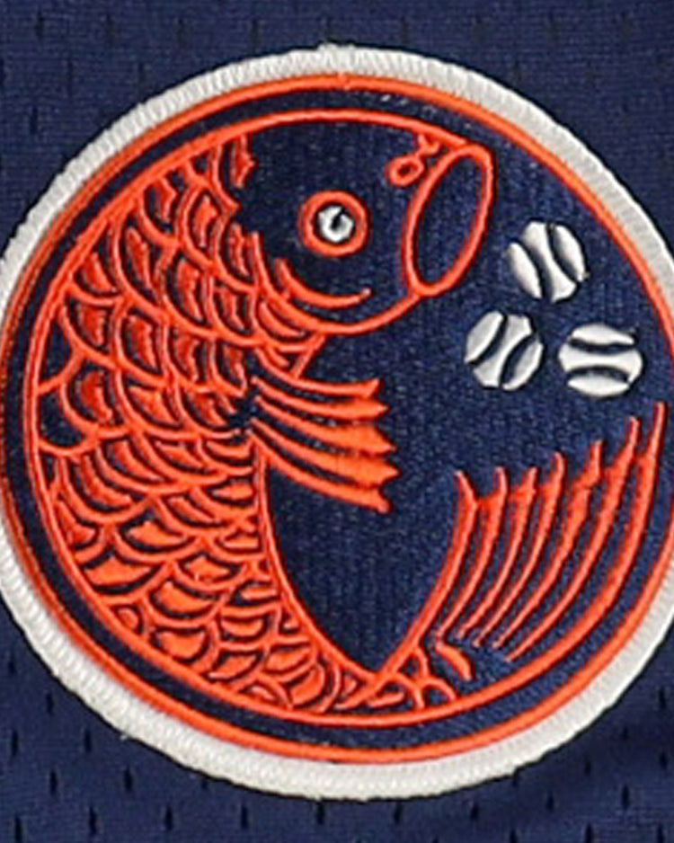The Hiroshima Carp EFF DNA Replica V-Neck Mesh Jersey by EFF features an orange fish with detailed scales and fins, inspired by the teams logo, on navy blue mesh with white baseball accents—evoking classic Ebbets Field Flannels style.