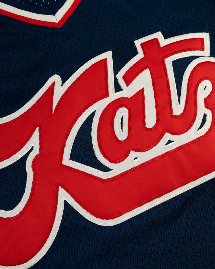 Close-up of the EFF Kansas City Katz Mesh V-Neck Jersey in navy, with Kats in bold red and white across the front—an homage to Kansas Citys iconic Katz Drugstore and its Ban Johnson Baseball League roots.