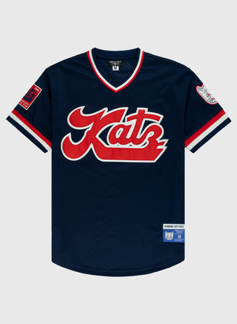 The Kansas City Katz Mesh V-Neck Jersey by EFF is a navy blue baseball jersey with red and white trim, bold red Katz script on the chest, sleeve patches, inspired by Kansas Citys historic Katz Drugstore.