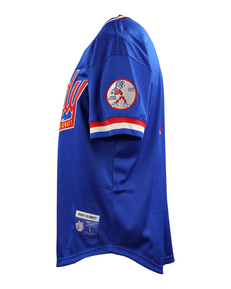 The EFF Reddy Kilowatt EFF DNA Replica V-Neck Mesh Jersey is shown from the side, with red and white striped sleeves, a Reddy Kilowatt safe electricity patch on the right sleeve, and stitched labels near the bottom hem.