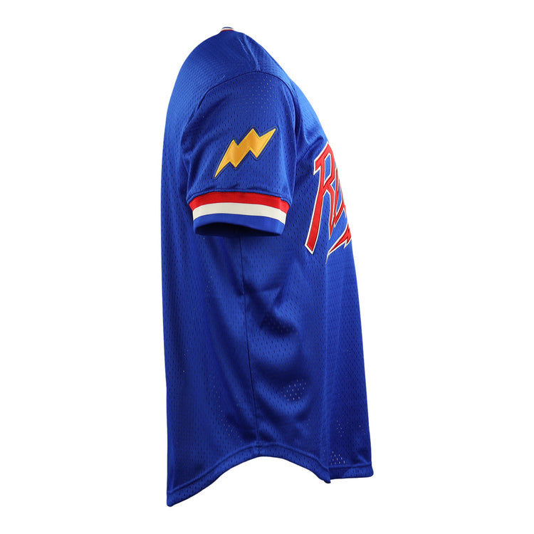 The EFF Reddy Kilowatt EFF DNA Replica V-Neck Mesh Jersey is blue with red, white, and blue sleeve trim, a yellow lightning bolt patch inspired by Reddy Kilowatt, and a red and white chest logo—shown from the side.