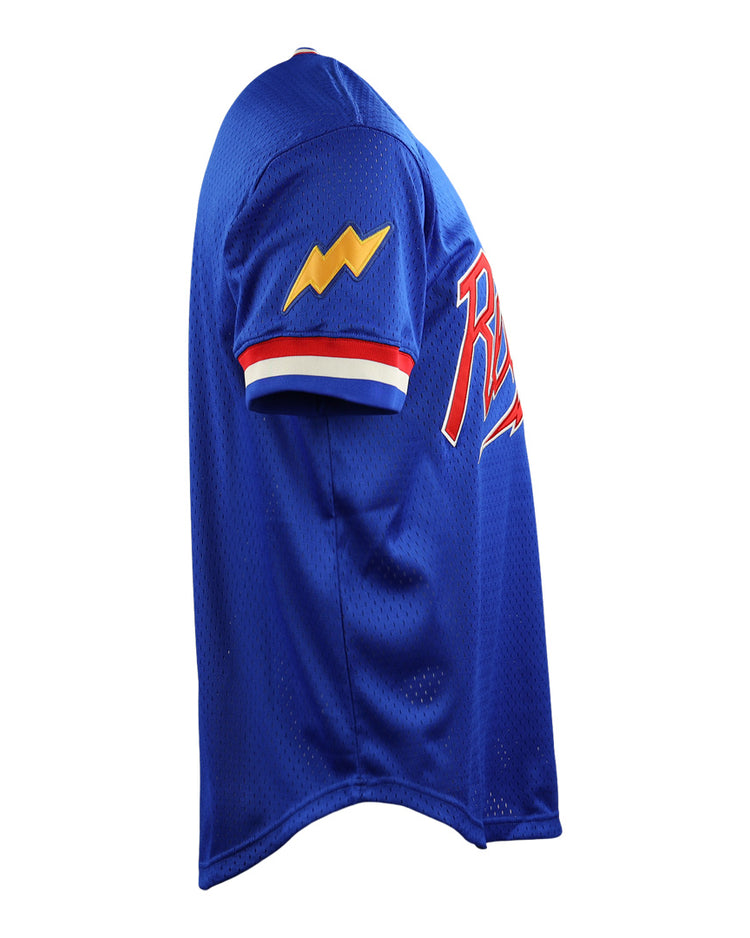 The EFF Reddy Kilowatt EFF DNA Replica V-Neck Mesh Jersey is blue with red, white, and blue sleeve trim, a yellow lightning bolt patch inspired by Reddy Kilowatt, and a red and white chest logo—shown from the side.
