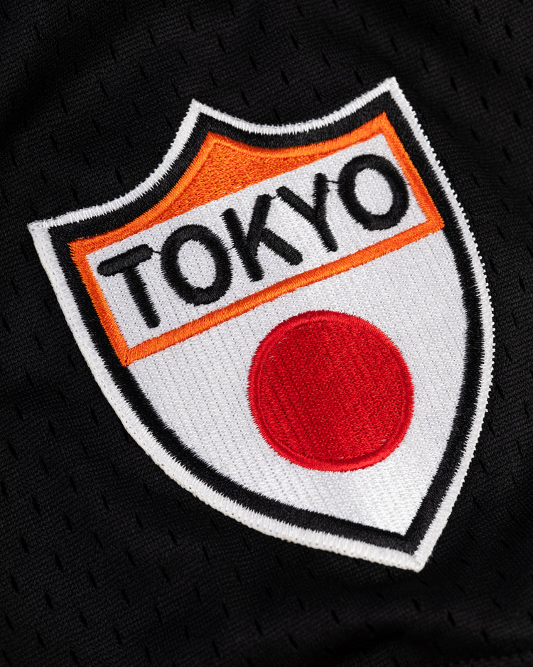 Inspired by the Tokyo Giants, the EFF Tokyo Giants Mesh V-Neck Baseball Jersey features vintage styling with bold TOKYO lettering and a red circle echoing Japan’s flag, plus orange and black accents as a tribute to the team.