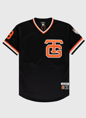 The EFF Tokyo Giants Mesh V-Neck Baseball Jersey features vintage-inspired black mesh with orange and white trim, a bold TG logo on the chest, number 8 on the left sleeve, and a team patch near the bottom hem.