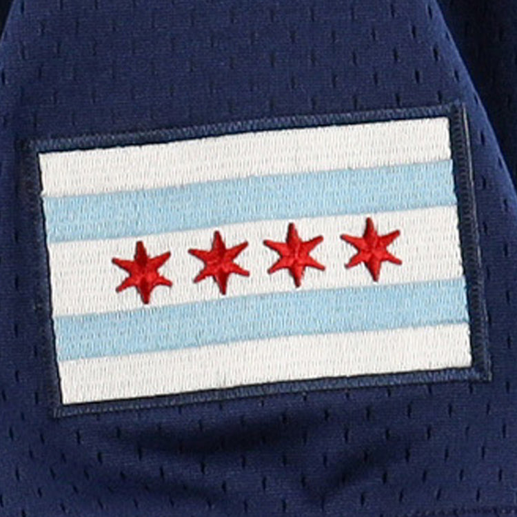The Chicago Whales EFF DNA Replica V-Neck Mesh Jersey by EFF features a rectangular patch of the Chicago city flag—two light blue stripes and four red six-pointed stars—sewn onto vintage-inspired dark blue mesh fabric.