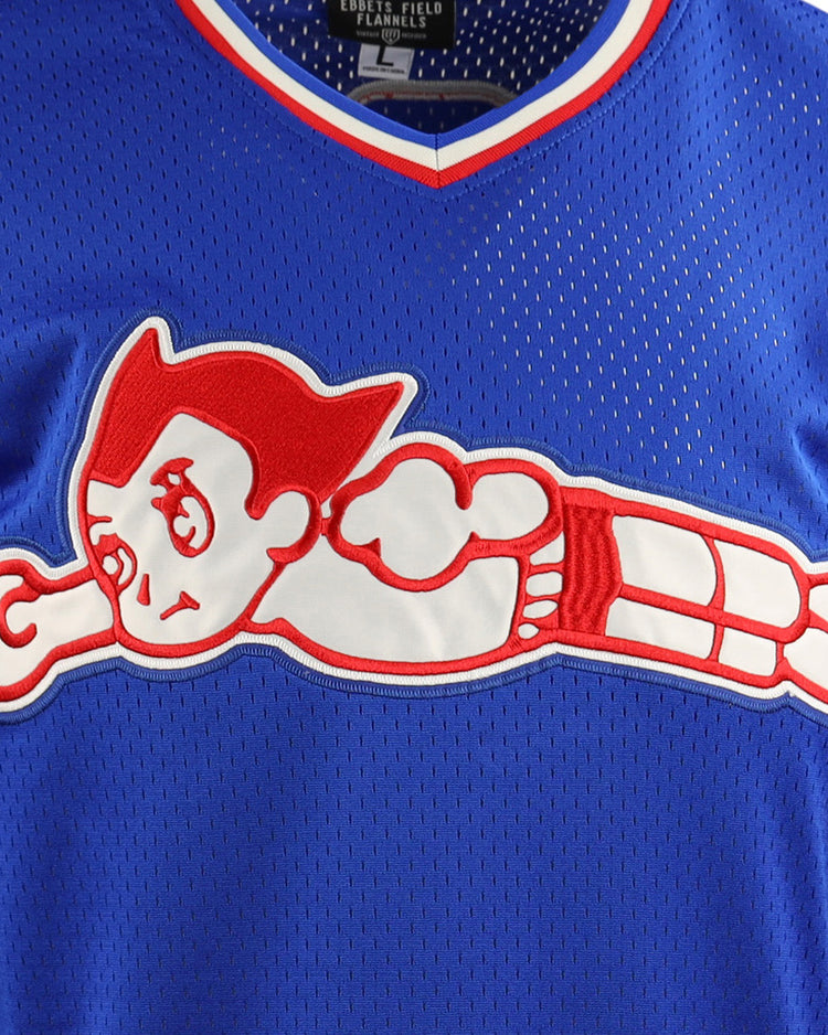 The EFF Sankei Atoms EFF DNA Replica V-Neck Mesh Jersey features blue mesh with red and white trim and a bold Atom Boy graphic, blending classic Japanese Central League style with a playful tribute to the iconic spiky-haired character.