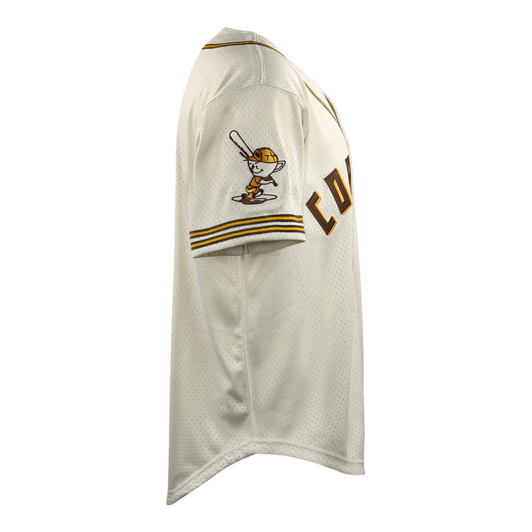 Side view of a white Cordoba Cafeteros EFF DNA Replica Button-Up Mesh Jersey by EFF, with yellow and brown trim, COUNT partially visible on the front, and a cartoon batter on the sleeve, inspired by Mexican baseball history.