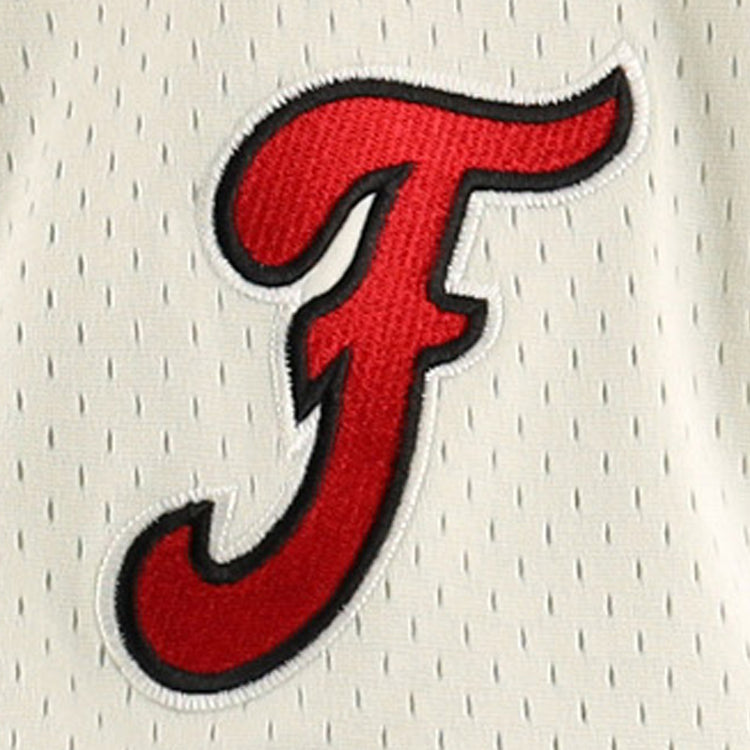 A red, stylized letter F with a black outline is embroidered on white mesh fabric, part of the Fuji Athletic Club EFF DNA Replica Button-Up Mesh Jersey by EFF.