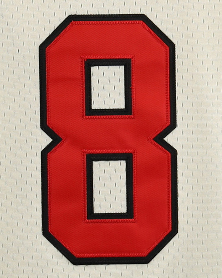 A large red number 8 with a black outline is stitched onto white mesh fabric, echoing the style of Japanese Baseball jerseys like the Fuji Athletic Club EFF DNA Replica Button-Up Mesh Jersey by EFF.
