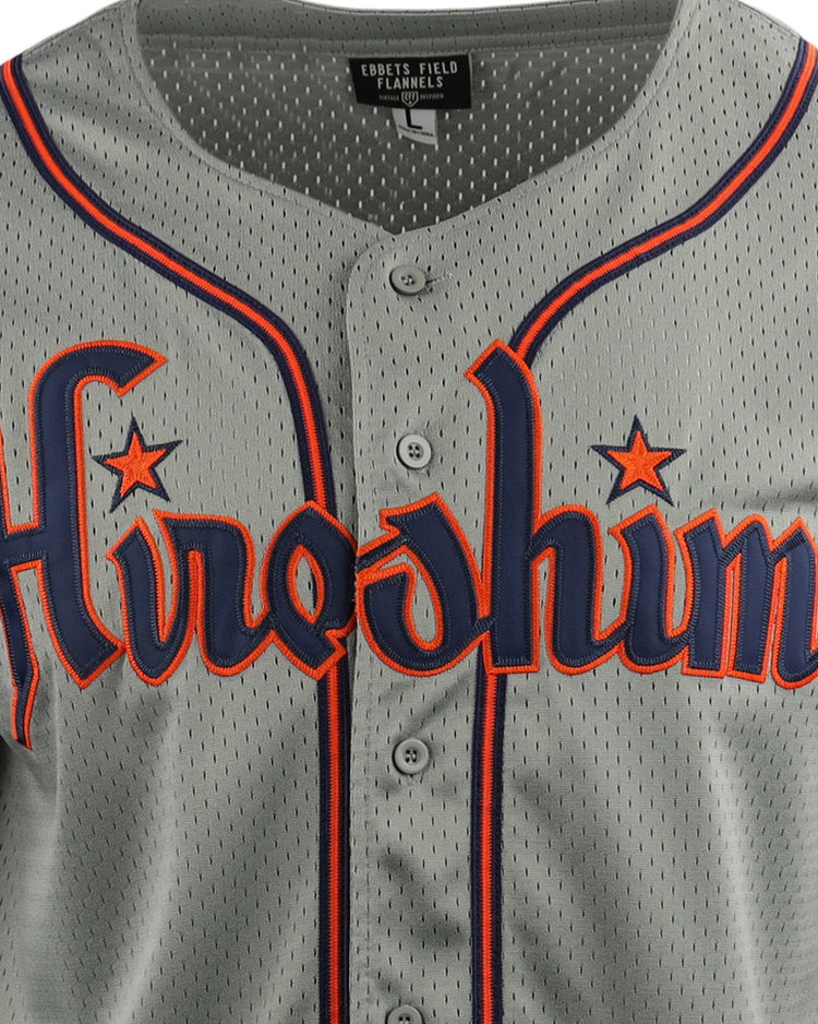The EFF Hiroshima Carp EFF DNA Replica Button-Up Mesh Jersey is a gray jersey with blue and orange trim, featuring Hiroshima across the chest in stylized letters inspired by vintage Japanese Central League designs.