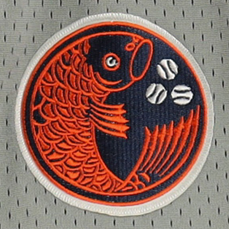 The Hiroshima Carp EFF DNA Replica Button-Up Mesh Jersey by EFF features a circular patch with an orange fish and three white baseballs on a dark blue background, sewn onto light gray perforated vintage mesh fabric.