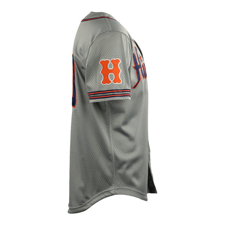 Side view of the Hiroshima Carp EFF DNA Replica Button-Up Mesh Jersey by EFF, a gray vintage mesh jersey with orange and navy accents, an orange H on the sleeve, and partially visible front text inspired by classic Ebbets Field Flannels designs.