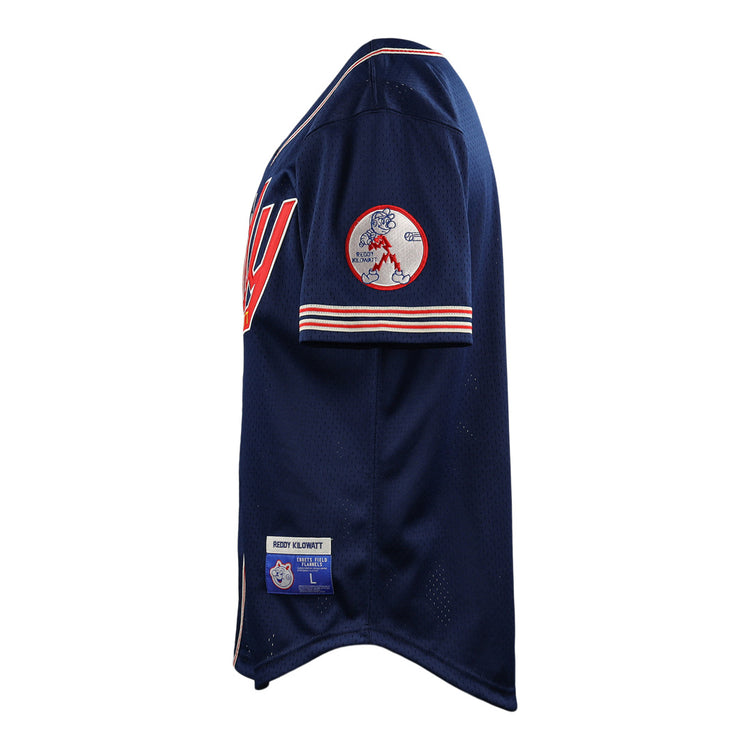 The EFF Reddy Kilowatt EFF DNA Replica Button-Up Mesh Jersey features navy blue mesh with red and white trim, a large “W” on the chest, Reddy Kilowatt team patch on the sleeve, and manufacturer tags by the hem. Shown from a side angle.