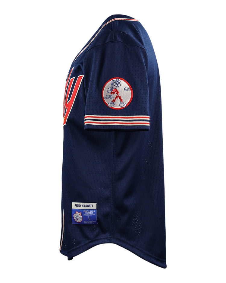 The EFF Reddy Kilowatt EFF DNA Replica Button-Up Mesh Jersey features navy blue mesh with red and white trim, a large “W” on the chest, Reddy Kilowatt team patch on the sleeve, and manufacturer tags by the hem. Shown from a side angle.