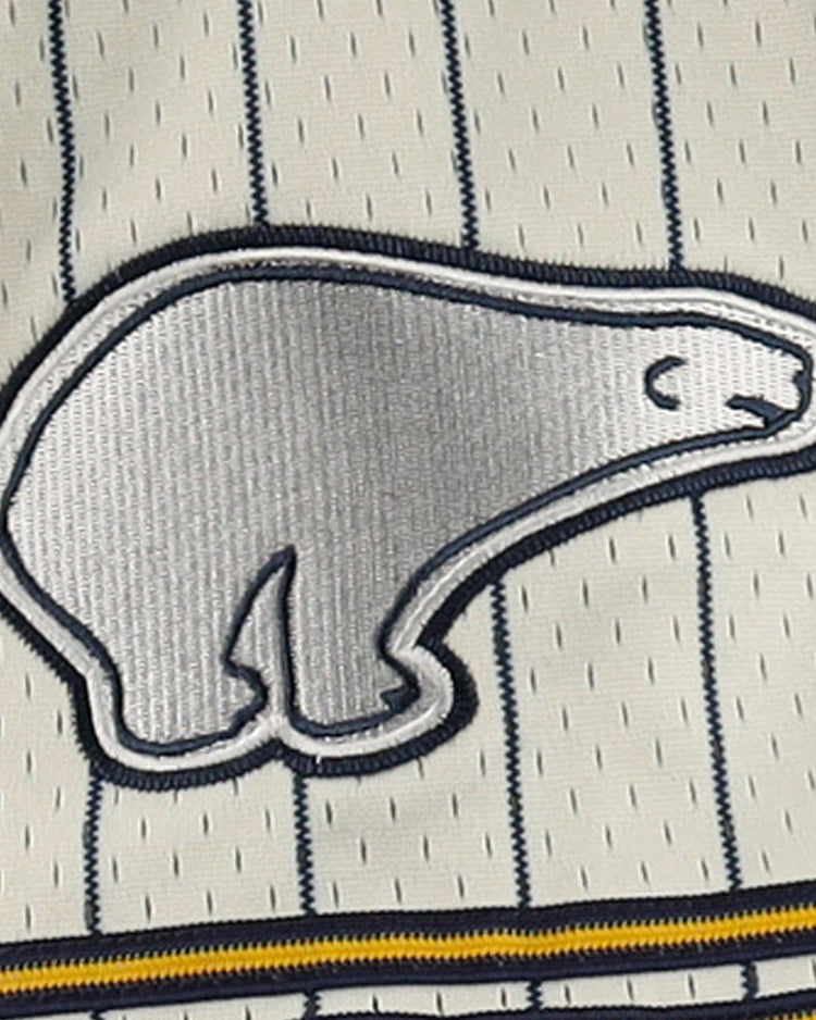 A silver and white embroidered polar bear patch, inspired by Cerveceria Polar, is sewn onto the cream pinstriped mesh fabric of the EFF DNA Replica Button-Up Jersey.