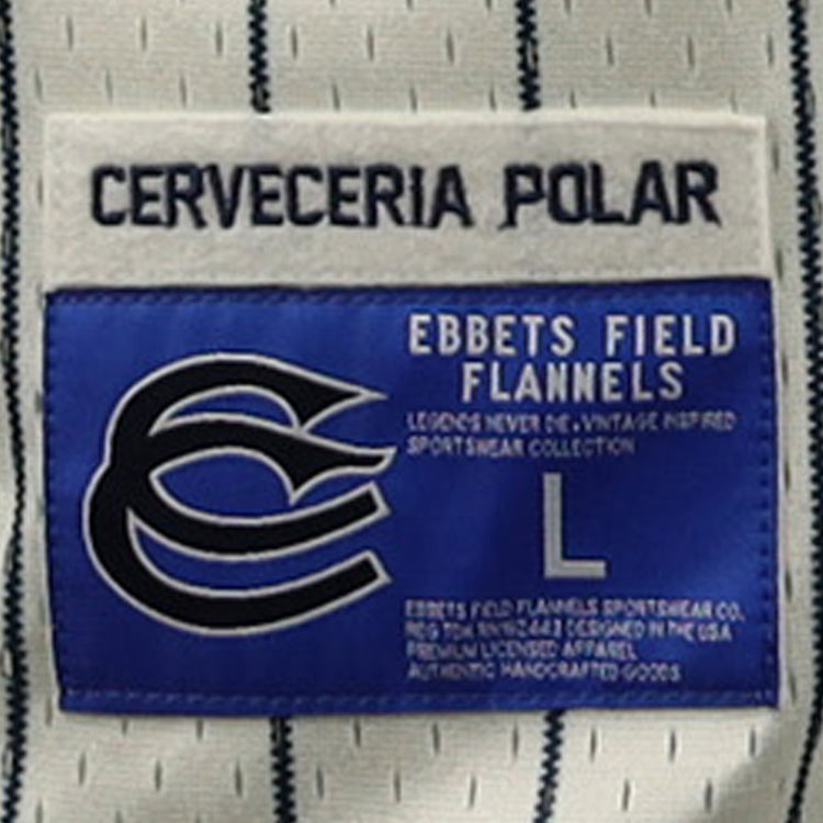 A close-up of a clothing label shows CERVECERIA POLAR, referencing Polar beer. Below, a blue EFF patch appears with the logo, size L, and details about the Cerveceria Polar EFF DNA Replica Button-Up Mesh Jersey.