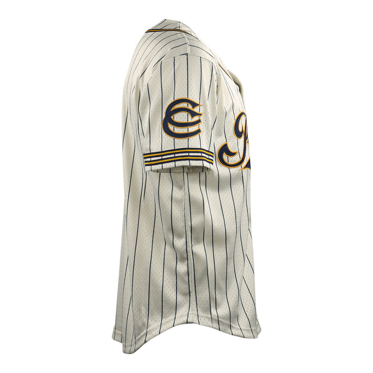 The EFF Cerveceria Polar DNA Replica Button-Up Mesh Jersey features a cream color, short sleeves, thin navy stripes, sleeve patches, and yellow trim inspired by classic Cuban League baseball uniforms—shown from a side view.