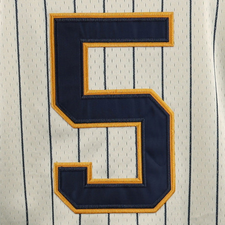 A close-up of the EFF Cerveceria Polar DNA Replica Button-Up Mesh Jersey, showcasing pinstripes and a bold navy number 5 accented with gold stitching.