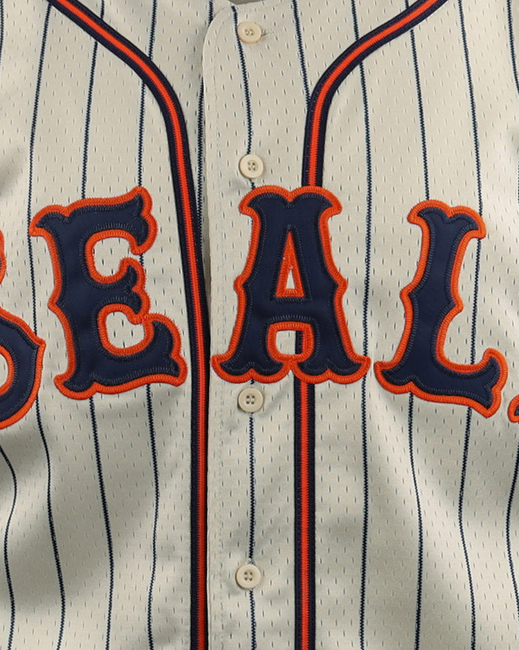 Close-up of the EFF San Francisco Seals DNA Replica Button-Up Mesh Jersey, with bold blue and orange SEALS lettering on white pinstripes—a vintage-inspired design by EFF honoring the classic San Francisco team.