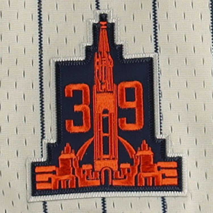 A sewn patch with a red building and 39 on navy, outlined in white, accents the white and blue pinstriped San Francisco Seals EFF DNA Replica Button-Up Mesh Jersey by EFF, inspired by vintage styles.