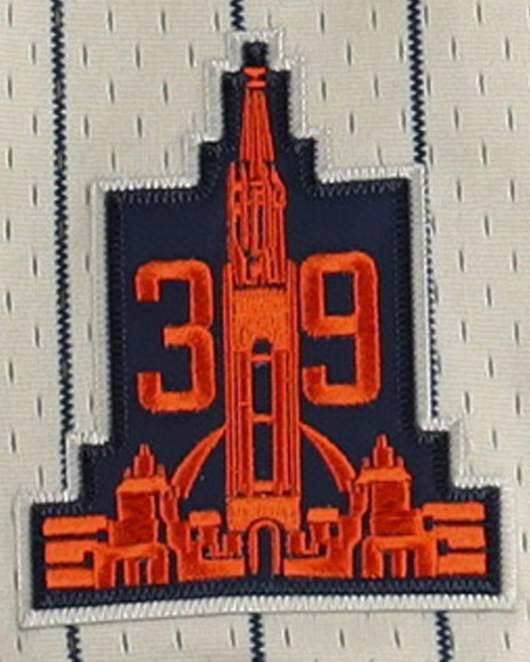 A sewn patch with a red building and 39 on navy, outlined in white, accents the white and blue pinstriped San Francisco Seals EFF DNA Replica Button-Up Mesh Jersey by EFF, inspired by vintage styles.