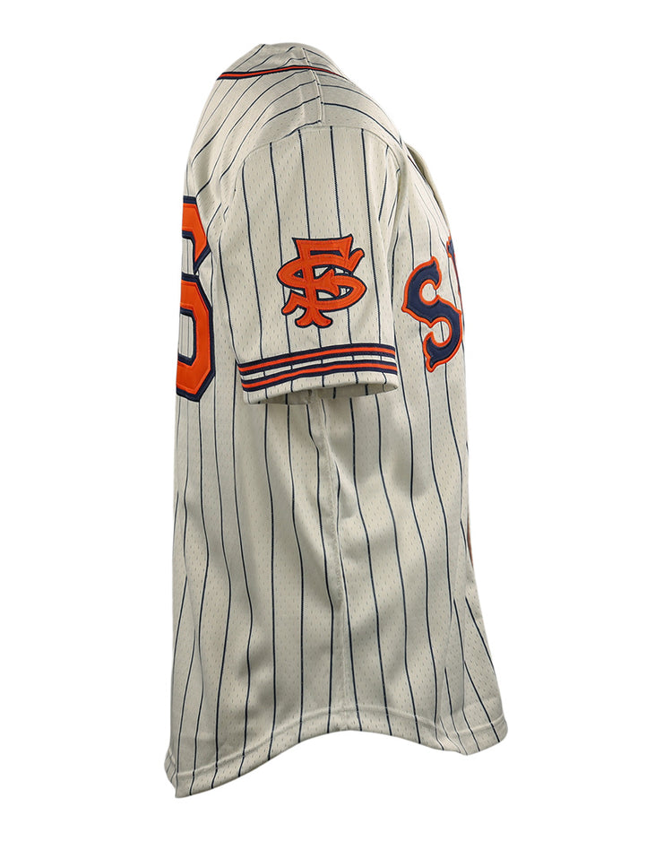 The EFF San Francisco Seals DNA Replica Button-Up Mesh Jersey features cream fabric with vertical navy pinstripes and orange and black logos and numbers on the sleeve and chest, shown from a side angle.