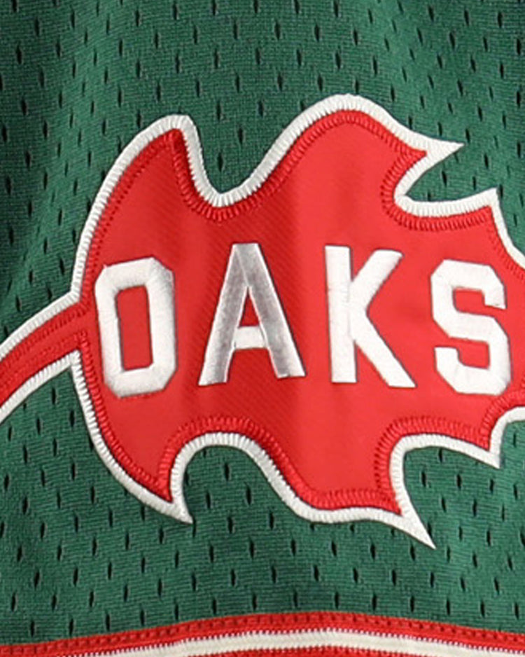 The Oakland Oaks EFF DNA Replica Button-Up Mesh Jersey by EFF features Pacific Coast League-inspired green mesh and a red oak leaf patch with “OAKS” in bold white letters across the center.