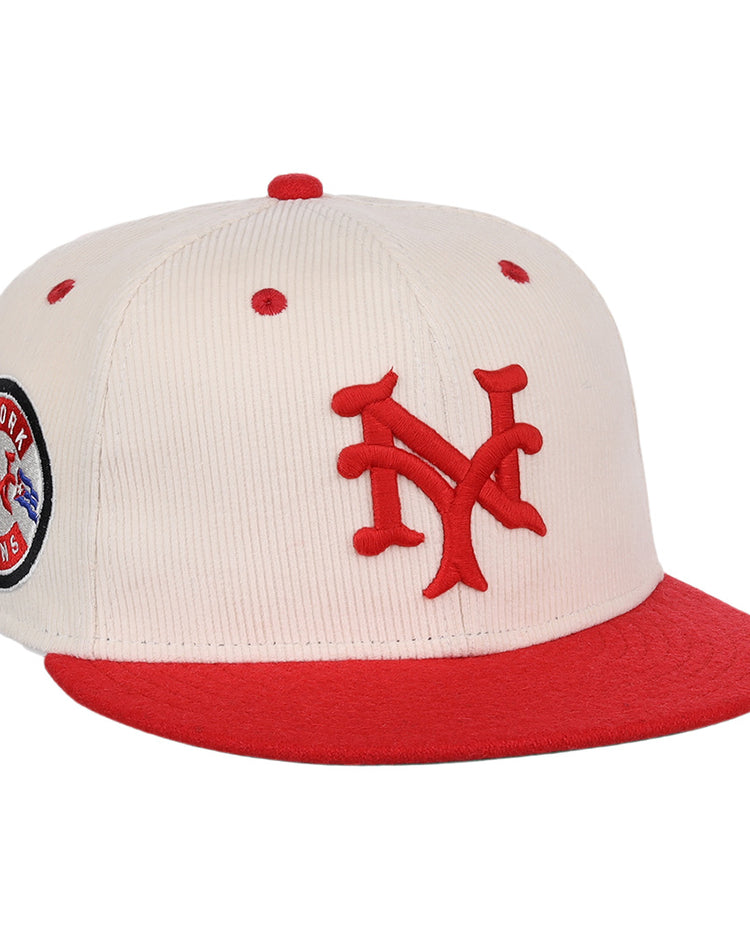 The EFF New York Cubans NLB Ground Rule Double Fitted Ballcap is a cream cap with a red brim, 3D NY embroidery, and a circular New York Cubans patch, inspired by Negro National League style.
