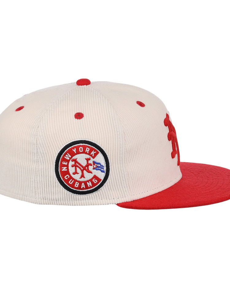 The EFF New York Cubans NLB Ground Rule Double Fitted Ballcap features cream corduroy, a red brim and button, a 3D NY logo, and a side patch reading New York Cubans in blue and red, honoring the Negro National League.