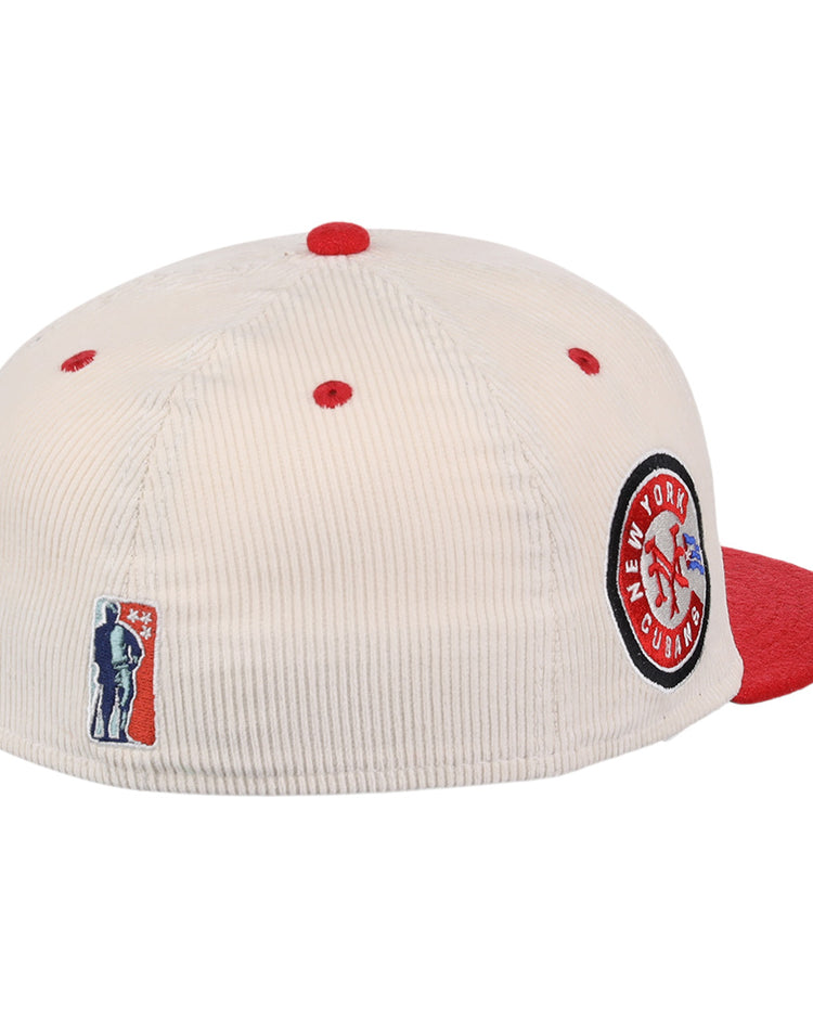 The EFF New York Cubans NLB Ground Rule Double Fitted Ballcap features a cream corduroy design with red accents and brim, a side patch honoring the Negro National League, and an embroidered baseball player logo above the back opening.