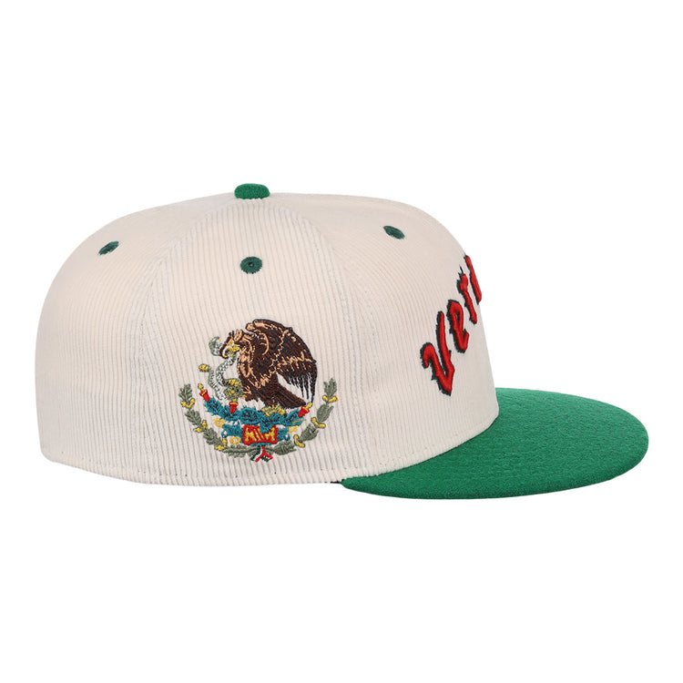 The EFF Veracruz Azules NLB Ground Rule Double Fitted Ballcap is a white and green hat with the Mexican national emblem embroidered on the side and partially visible red text on the front.