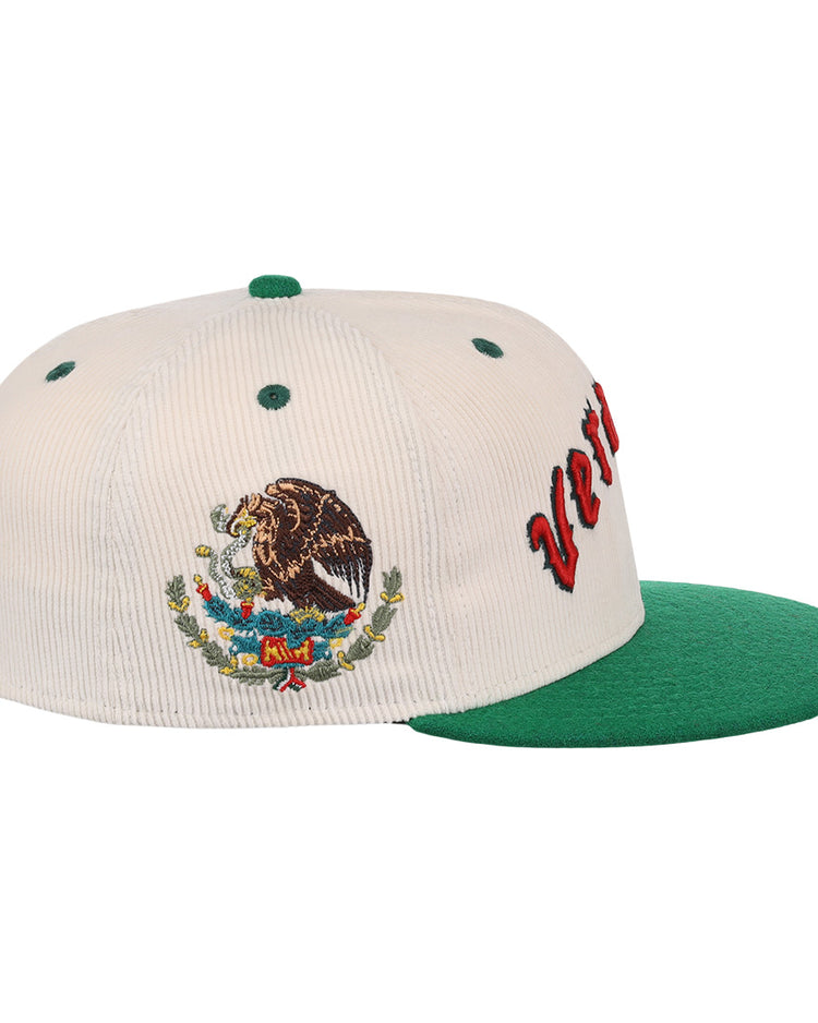 The EFF Veracruz Azules NLB Ground Rule Double Fitted Ballcap is a white and green hat with the Mexican national emblem embroidered on the side and partially visible red text on the front.