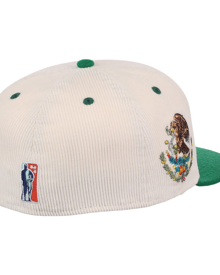 The EFF Veracruz Azules NLB Ground Rule Double Fitted Ballcap features cream corduroy, a green brim, the Mexican coat of arms embroidered on the side, and a silhouetted patch beside red and blue detailing on the back.
