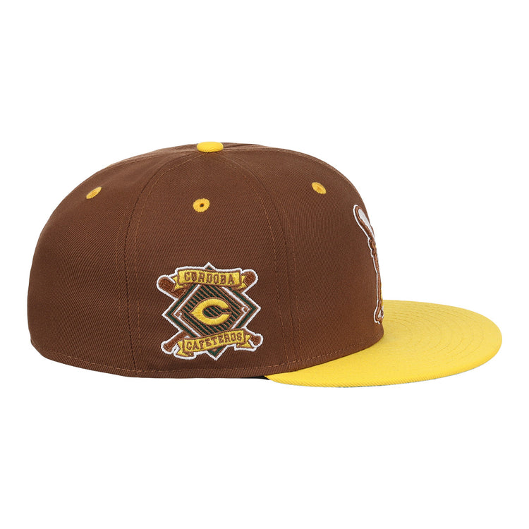 The Cordoba Cafeteros EFF DNA Fitted Ballcap by EFF is a vintage-inspired brown and yellow cap with a yellow brim and an embroidered Córdoba Cafeteros patch, celebrating Mexican League heritage.